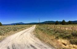 Aerial view of Oregon Nimrod River Park lot 12 block 31 in Klamath County, showing river views and surrounding land.