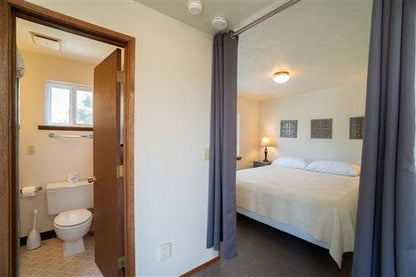 Cozy Oregon beach house at Sea Base Lincoln with outdoor seating and ocean views, ready for a 1-month rental deposit.