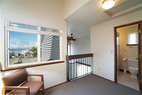 Sea Base Oregon Beach House rental deposit, showing a cozy coastal home with beachside views and outdoor seating.