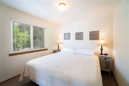 Sea Base Oregon Beach House rental deposit from Onlinelandsales, featuring a cozy beach house with ocean views and landscaped surroundings.
