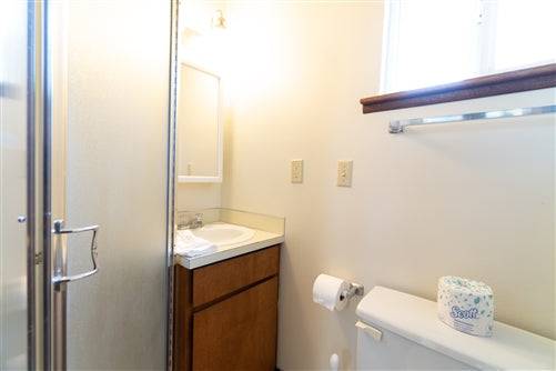 Beach house rental deposit for Sea Base Oregon onlinelandsales, showing a cozy coastal home exterior with ocean views.