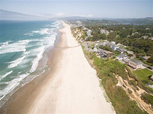 Oceanfront Oregon beach house rental deposit at Sea Base, with view of the Lincoln coast and sandy shoreline.