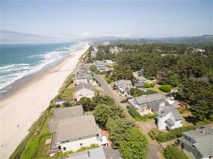 Sea Base Oregon Beach House rental deposit from Onlinelandsales, showing a cozy coastal home exterior with ocean views.