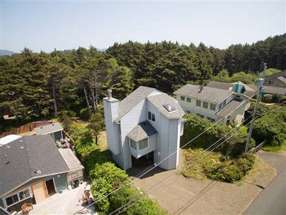 Oceanfront Oregon beach house rental deposit from Sea Base Oregon, showing a cozy coastal home with a sandy beach view.