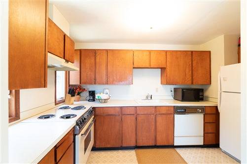 Beach house rental deposit at Sea Base Oregon, showing a cozy coastal property with large windows and ocean views.