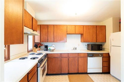 Beach house rental deposit at Sea Base Oregon, showing a cozy coastal property with large windows and ocean views.