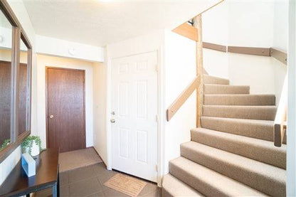 Beach house rental deposit at Sea Base Oregon, showing a charming coastal home with a front porch and ocean view.
