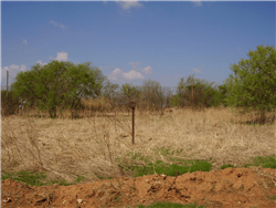 Aerial view of Texas Foard County Crowell lot 22 and 23, 0.16-acre land in Block 94, showing property boundaries and surrounding area.