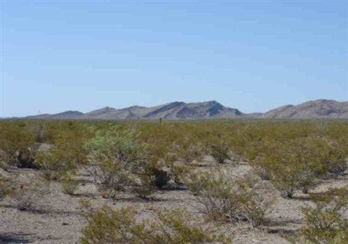 Aerial view of Texas Hudspeth County 86.9-acre El Paso lot 3, showcasing open land with sparse vegetation and surrounding landscape.