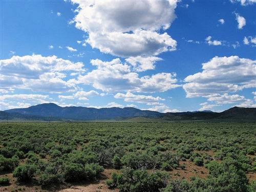 Aerial view of Utah Iron County Garden Valley Ranchos 2.27-acre property, scenic landscape with open land and natural features.