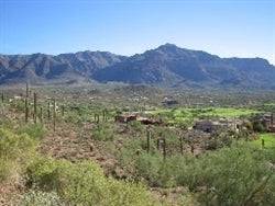 Aerial view of Mohave County, Arizona, showing a 0.07-acre lot near Kingman along Mercantile Highway with desert landscape.