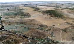 Aerial view of 1.25-acre lakefront land in Mohave County, Arizona, near Lake Havasu, showing desert landscape and water access.
