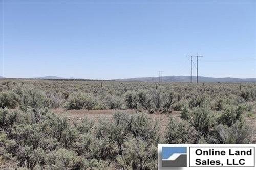 Aerial view of 36-acre Ravendale Ranch property in Lassen County, California, with open land and nearby power lines.