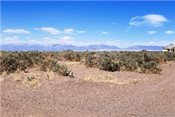 Aerial view of Colorado Alamosa County lot 23 in Town of Mosca, showing surrounding land and rural terrain.