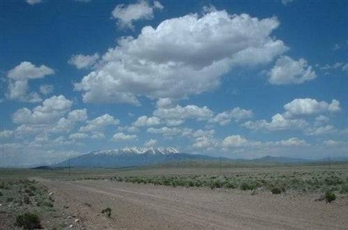 A scenic view of Mount Blanca in Alamosa County, Colorado, with 5-acre ranch land in the Alamosa Valley on a clear day.