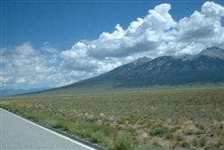 Aerial view of Colorado Alamosa County 5-acre Mount Blanca Valley Ranch land, with scenic mountains and open landscape.
