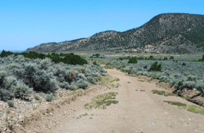 Aerial view of Colorado Sangre De Cristo Ranches Lot 4883, 5.05 acres in Costilla County, showing open land and surrounding terrain.