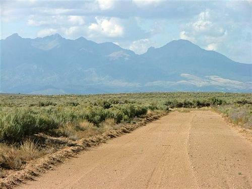 Aerial view of 5-acre Colorado San Luis Estates South land in Costilla County, with open terrain and natural landscape.