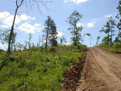 Aerial view of Missouri Shannon County Antler Ridge 28.8-acre land parcel, lush forested terrain with clear boundaries.