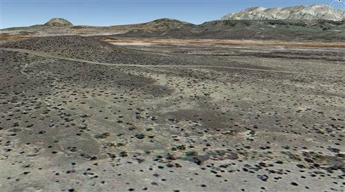 Aerial view of 10-acre Texas land in Brewster County, with natural desert landscape and open skies, offered by OnlineLandSales.