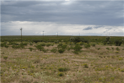 Aerial view of a 5.09-acre lot in La Hacienda Estates, Hudspeth County, Texas, showing open land and natural surroundings.